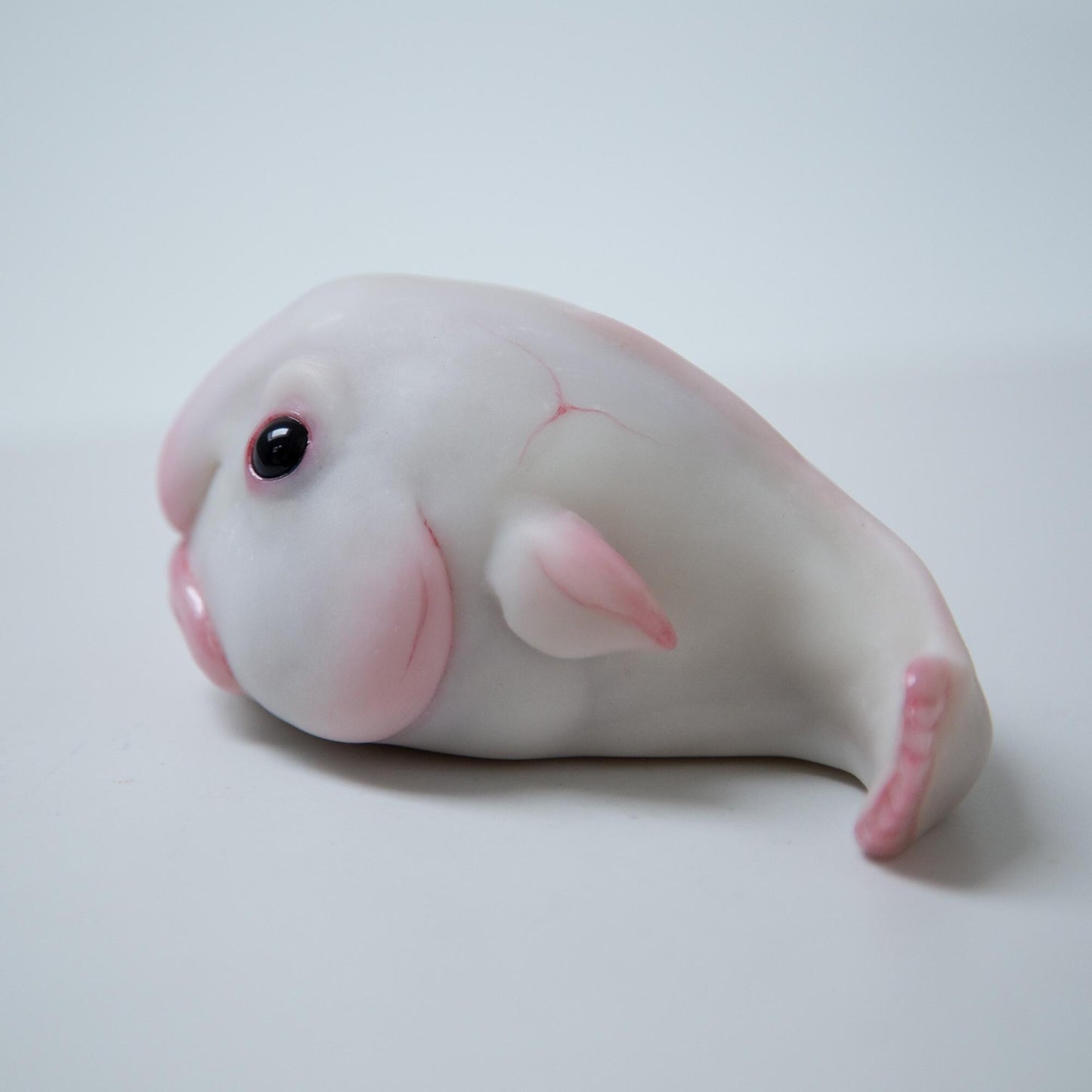 Cute sad and funny blobfish anime figurine, weird geek pop art sculpture