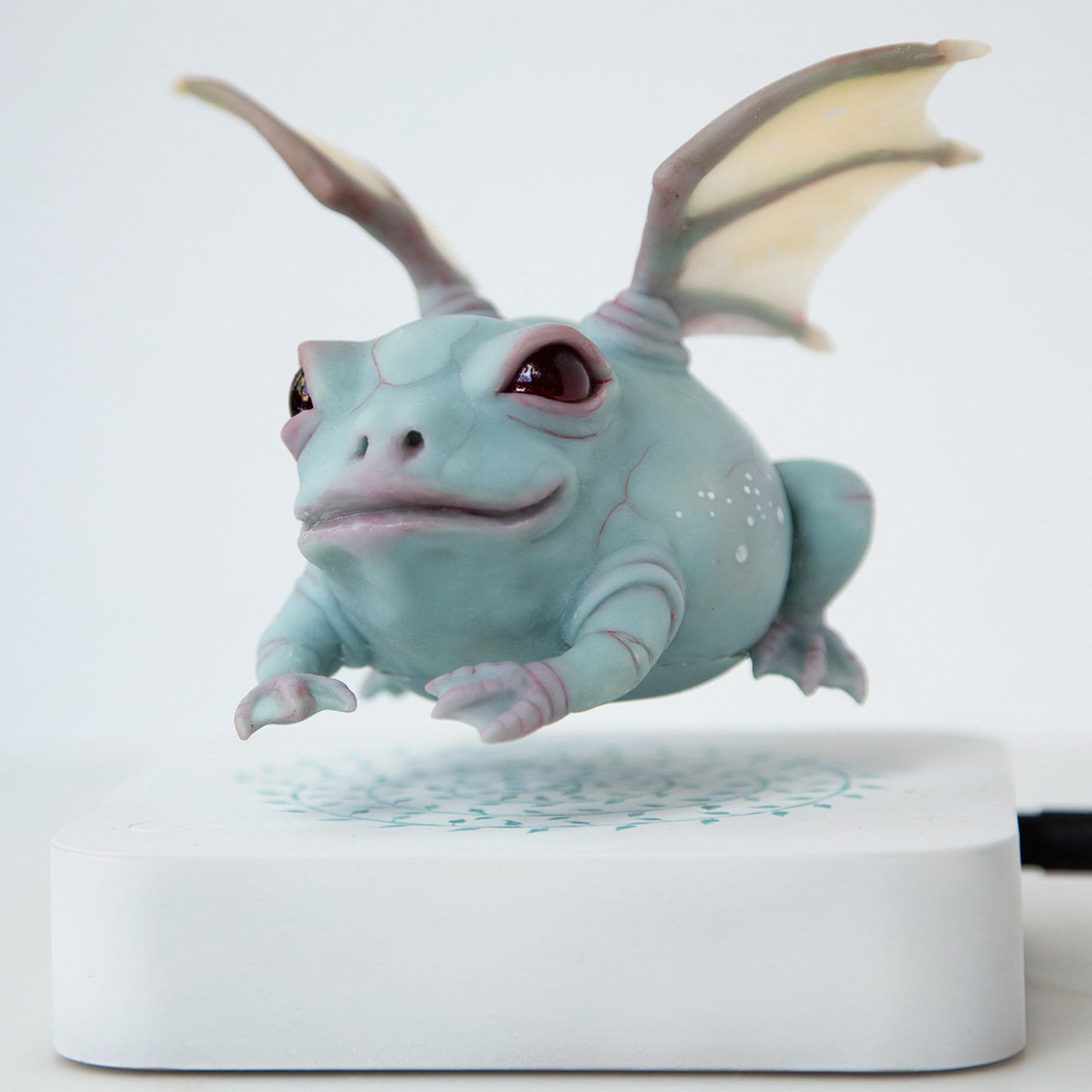 Levitating frog kinetic sculpture with dragon wings, weird and magic frog doll figurine with levitation pod