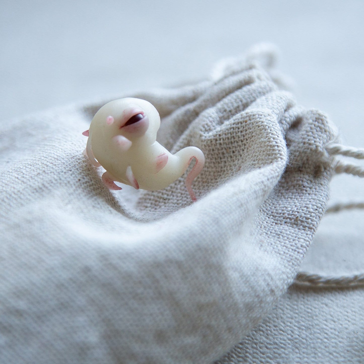 Baby Dragon embryo sculpture by CocoonToy. Polymer clay fantasy spawn fetus.