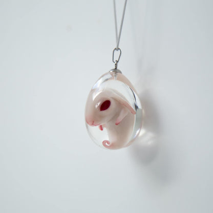 Baby Rabbit in egg pendant. Embryo jewelry, necklace with cute rabbit inside the crystal clear egg shaped epoxy pendant