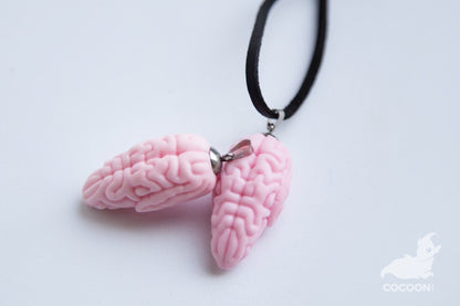 Pink colored brain small sculpture made as pandant for necklace