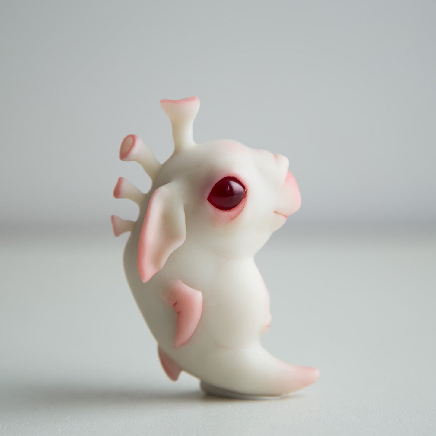 Baby alien weird sea horse sculpture art doll,  cute figurine with albino eyes in anime style