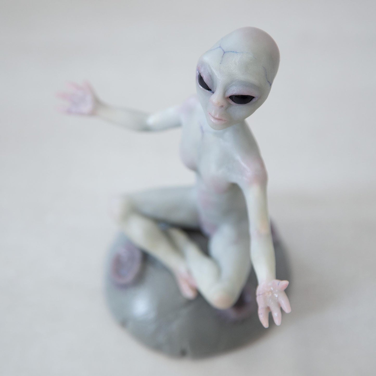 Magnetic levitation kinetic sculpture of alien, art doll creature from fantastic planet