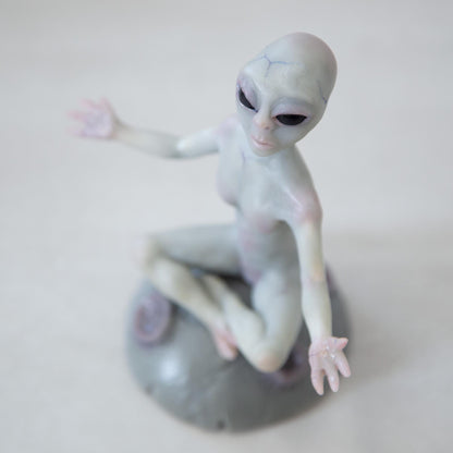 Magnetic levitation kinetic sculpture of alien, art doll creature from fantastic planet
