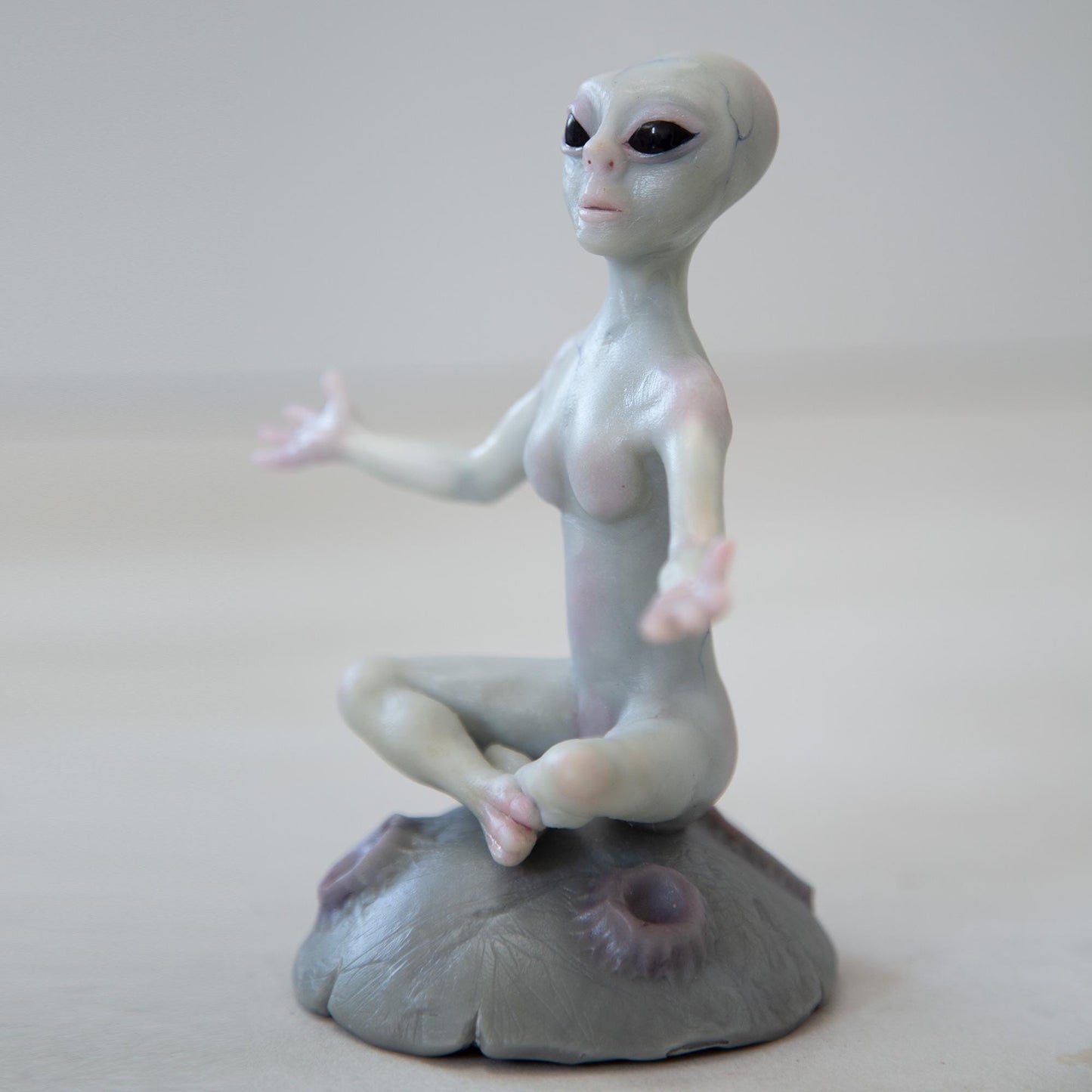 Magnetic levitation kinetic sculpture of alien, art doll creature from fantastic planet