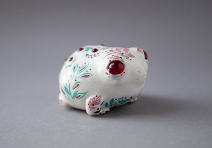 Small and cute rainfrog sculpture with handpainted ornament in Provance style. Pallet of ornament is green, red, pink, brown and black