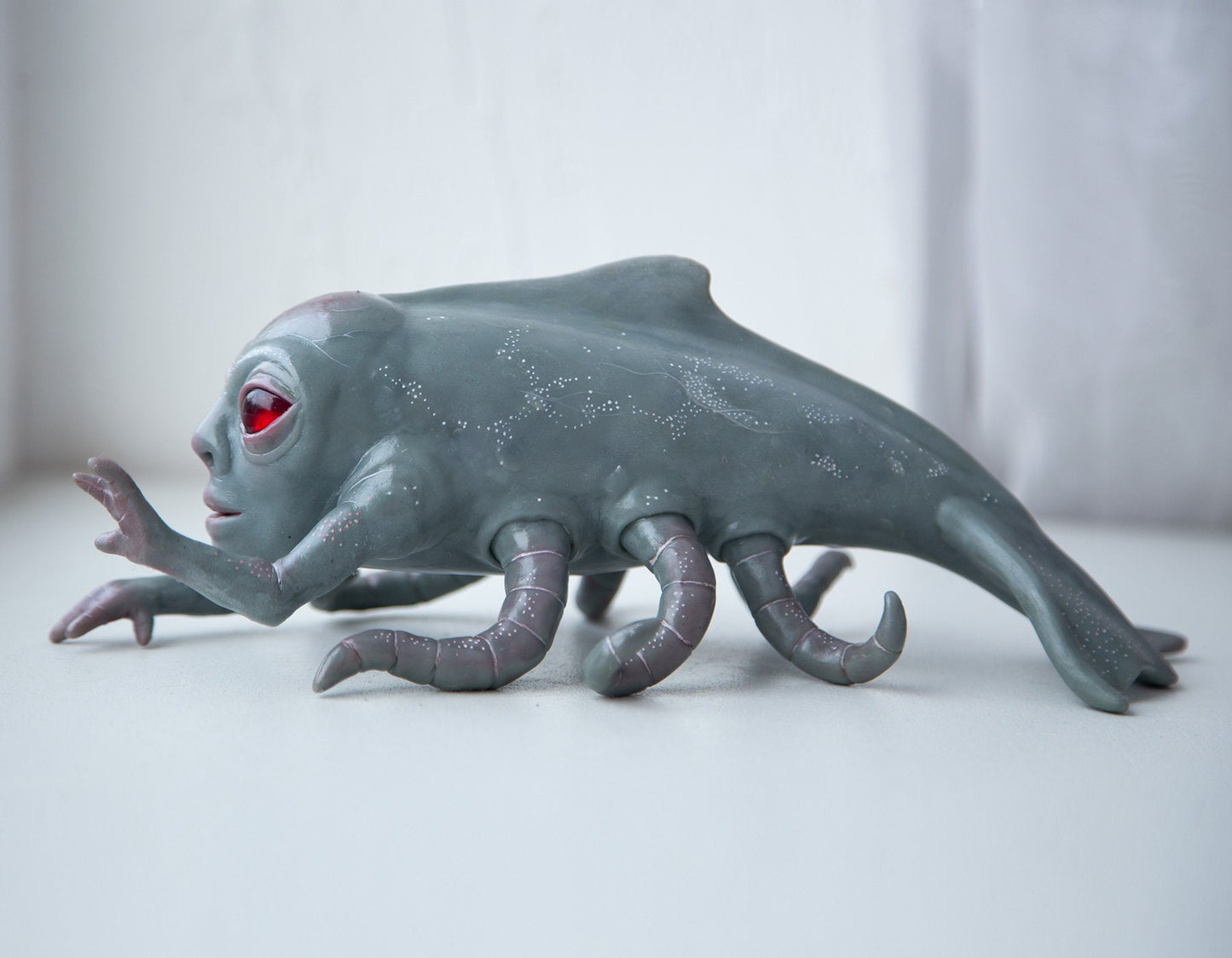 Alien cryptid kraken-whale deep sea creature, creepy sculpture, alien figurine with tentacle