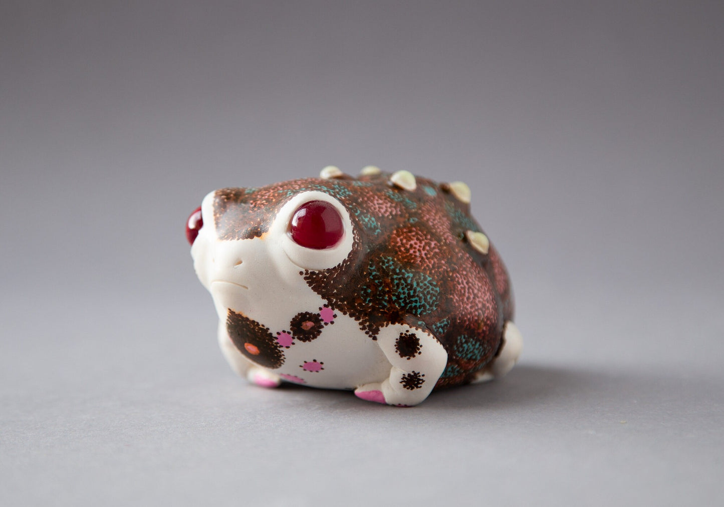 OOAK weird sculpture of frog with european folk art ornament and luminescent glow in the dark pimples