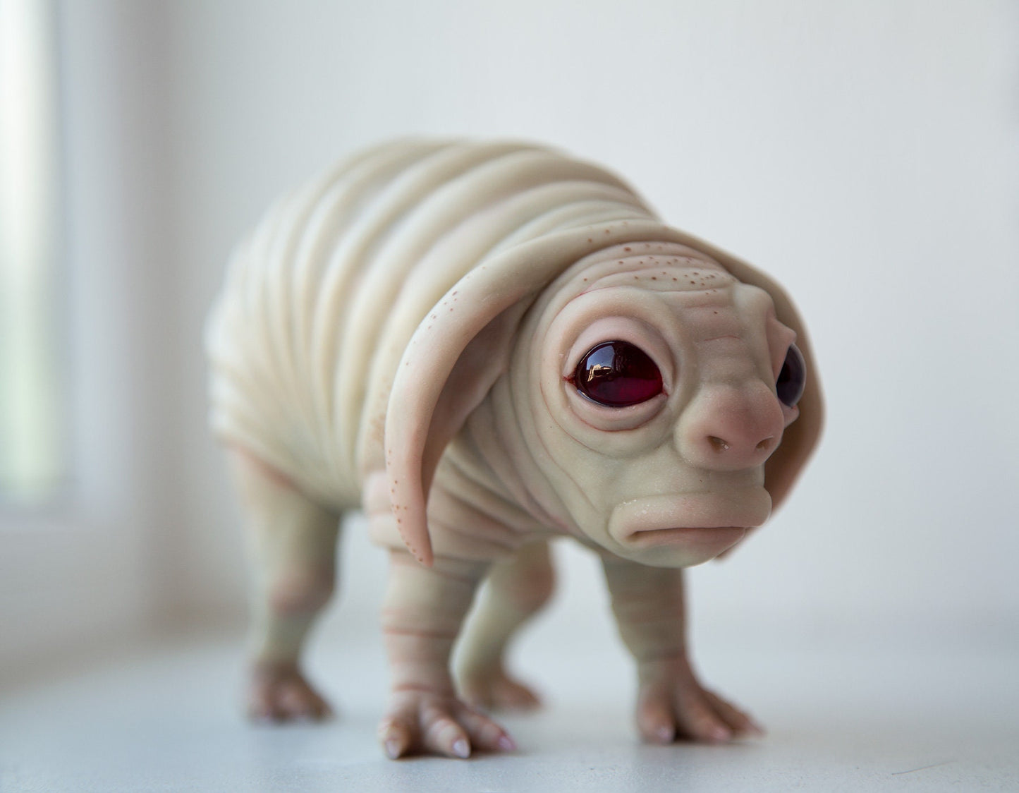 Squonk of Pennsylvania, creepy cute weird and sad PA cryptid creature, weird sculpture cryptid miniature