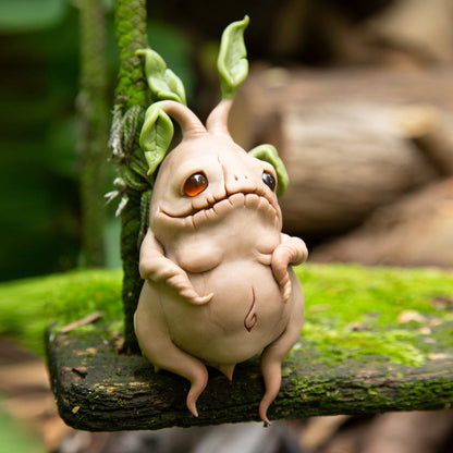 Manrake Mandragora figurine, cute and creepy mandrake magic root from Harry Potter universe. Sculpture made from brown polymer, eyes from amber-colored epoxy and leaves from green polymer clay