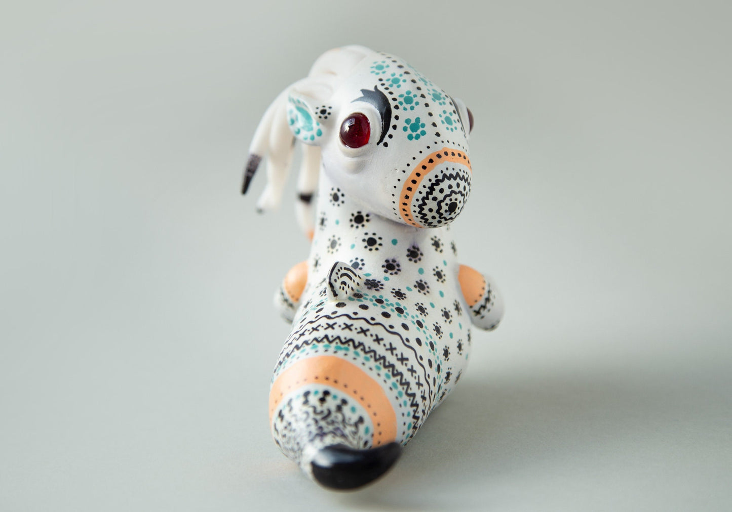 Dragon art doll with handpainted folk art ornament in swedish - norwegian - finnish style