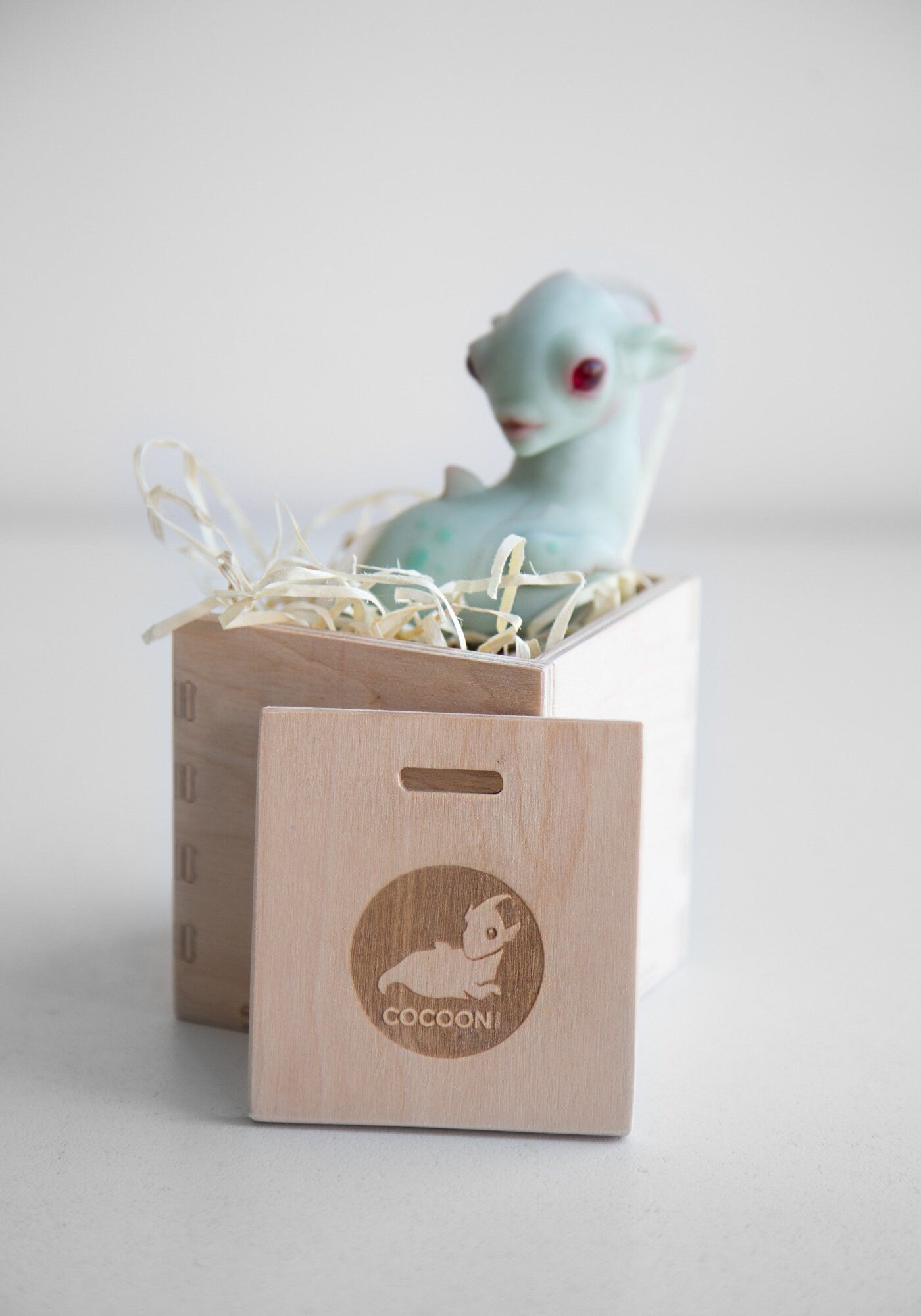 Dragon art doll with handpainted folk art ornament in swedish - norwegian - finnish style