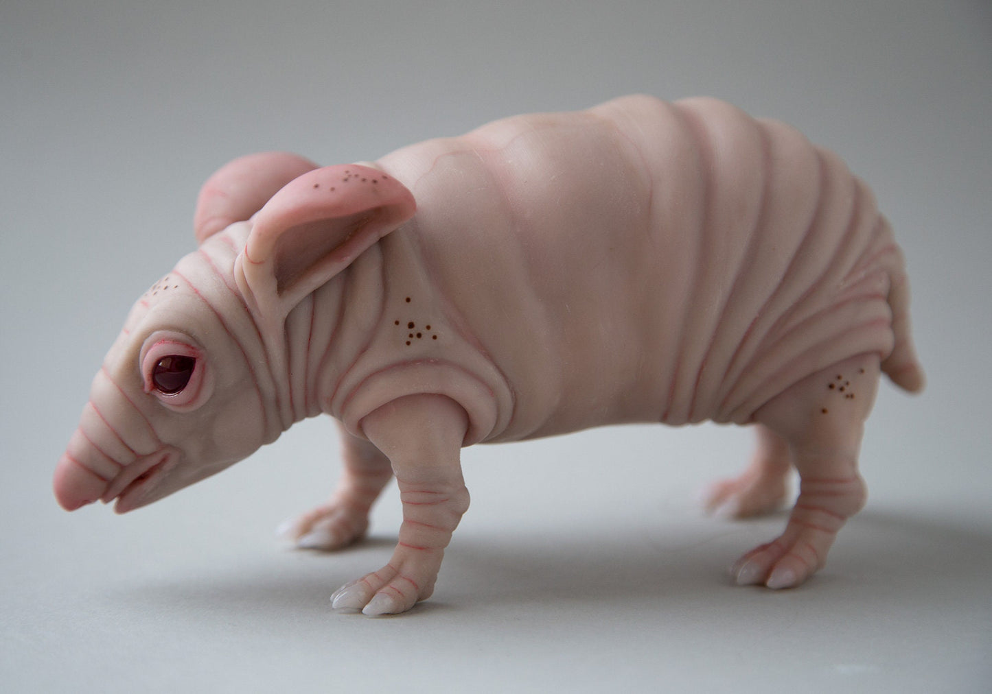 Fat and cute hamster-guinea pig-rat naked animal art doll. Nude and pink like mice mouse figurine