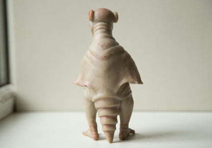 Strange, weird and unusual creepy alien doll sculpture, fantastic pinguin like beast, creepy surreal dark art