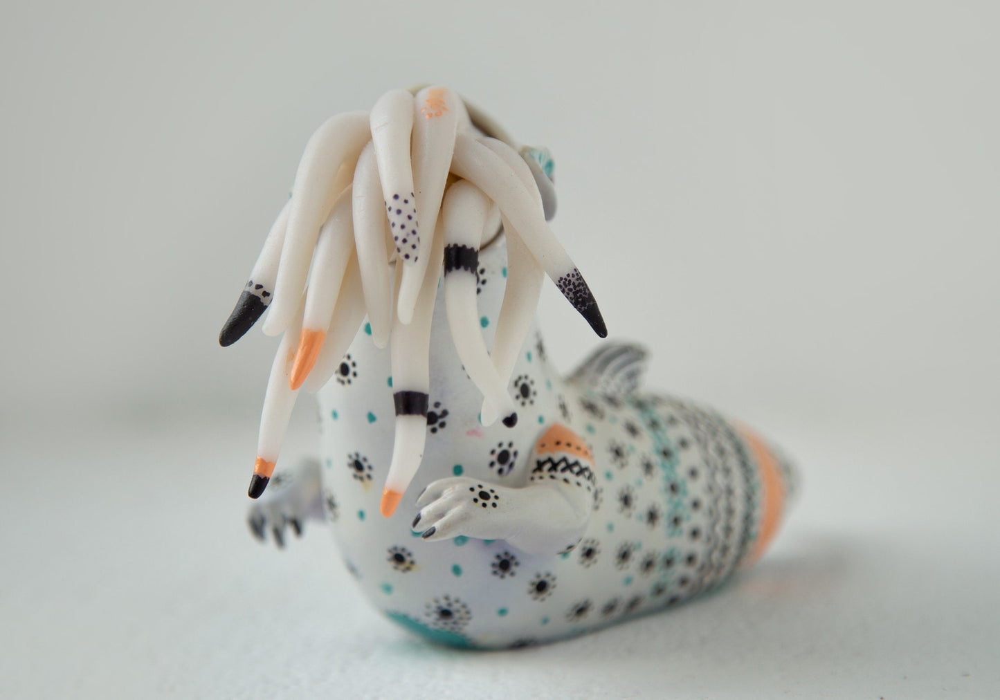 Dragon art doll with handpainted folk art ornament in swedish - norwegian - finnish style