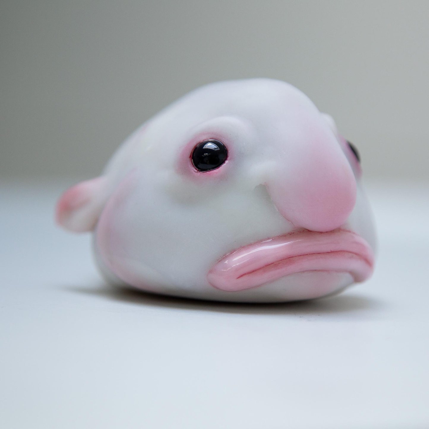 Cute sad and funny blobfish anime figurine, weird geek pop art sculpture