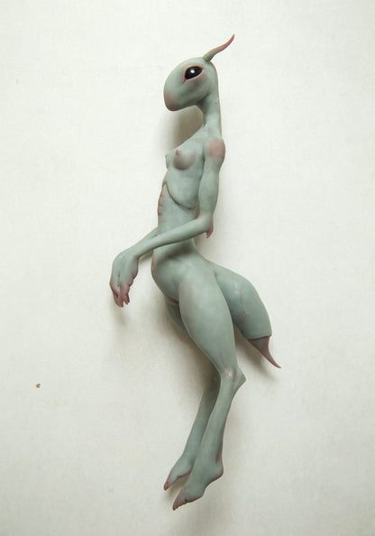 Alien girl sculpture, sexy sci fi character with thin body and cute face