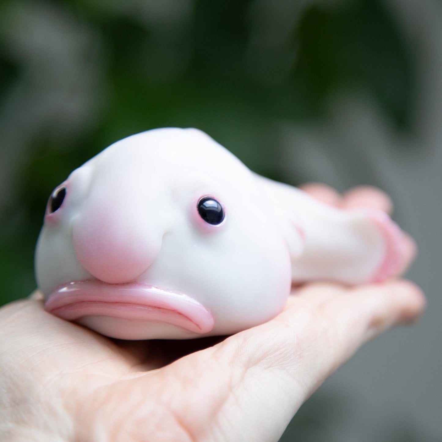 Cute sad and funny blobfish anime figurine, weird geek pop art sculpture