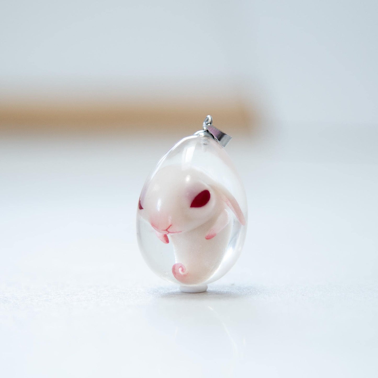 Baby Rabbit in egg pendant. Embryo horror jewelry, necklace with cute rabbit inside