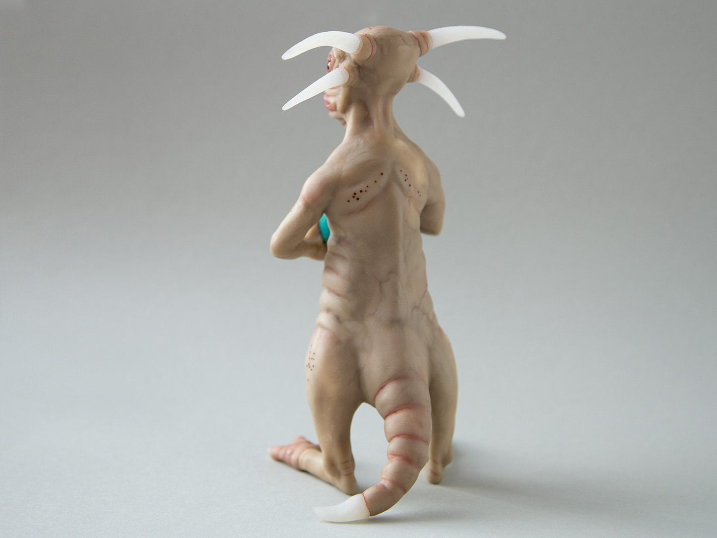 Horror creepy demon doll sculpture, devil statue with tail, weird horror figurine sculpture with 4 horns