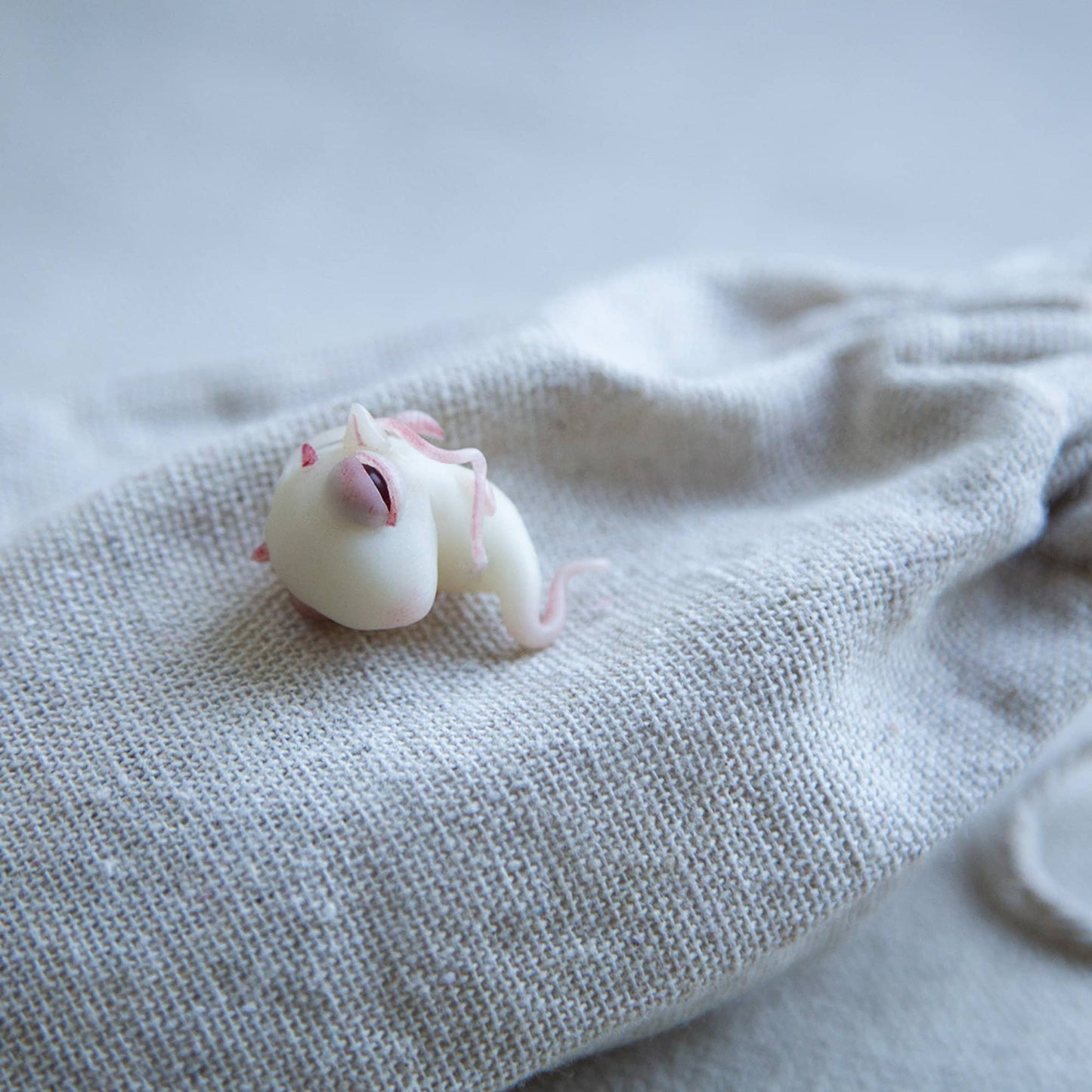 Baby Dragon embryo sculpture by CocoonToy. Polymer clay fantasy spawn fetus.