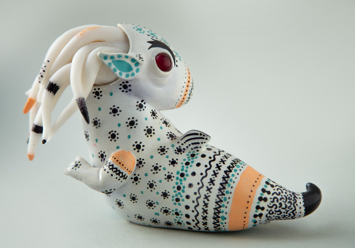 Dragon art doll with handpainted folk art ornament in swedish - norwegian - finnish style