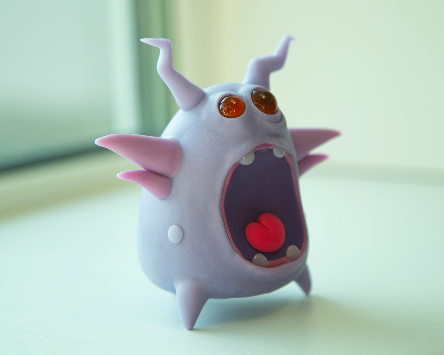 Cute and unusual Germ monster. It has two eyes, three legs, crying creepy face. Figurine made from violet colored polymer cla