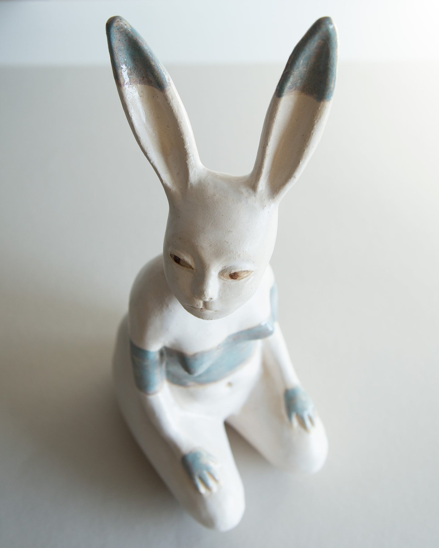 Ceramic statue of hare bodypositive girl, whimsical guitar body rabbit character, weird bunny sculpture decor