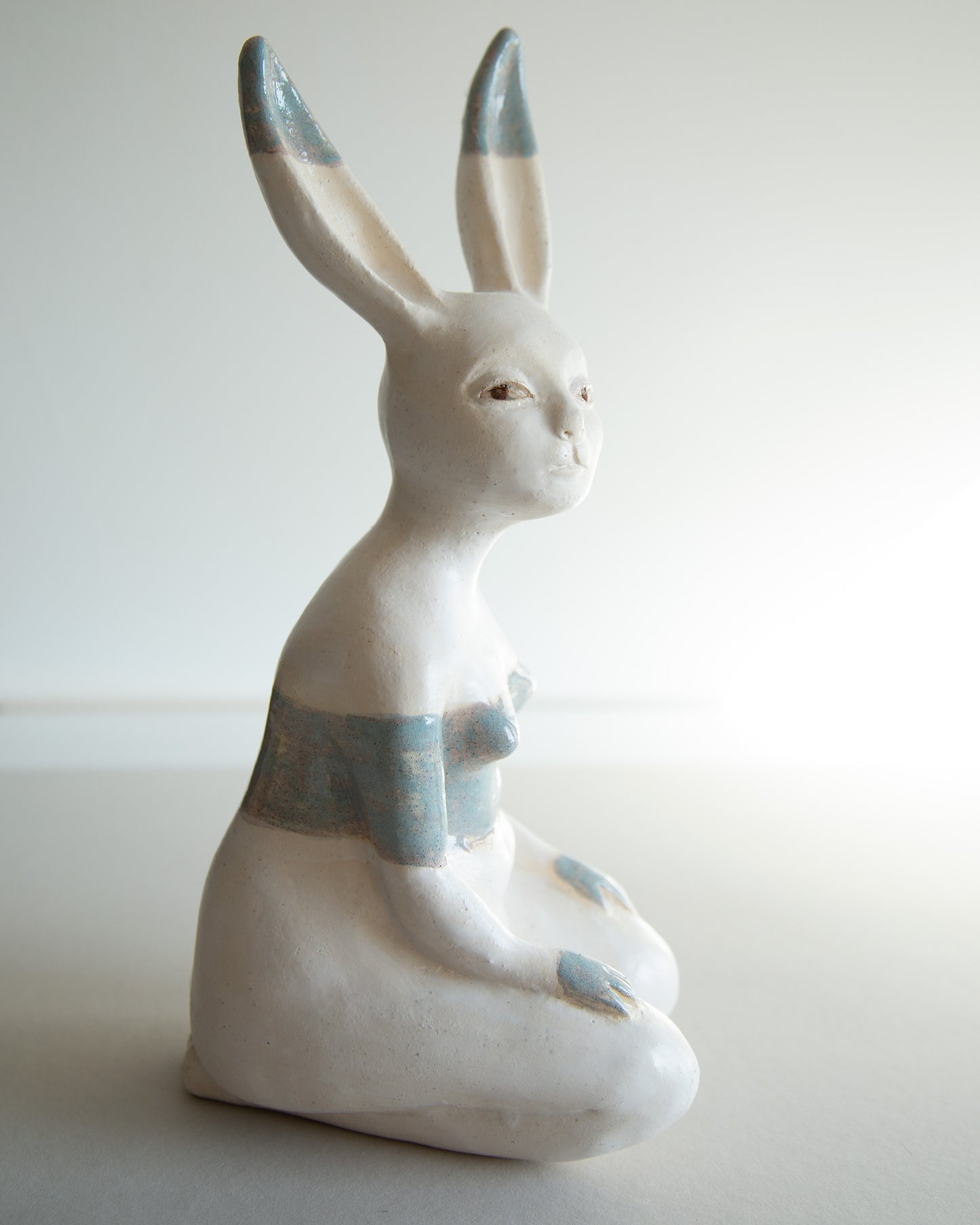 Ceramic statue of hare bodypositive girl, whimsical guitar body rabbit character, weird bunny sculpture decor