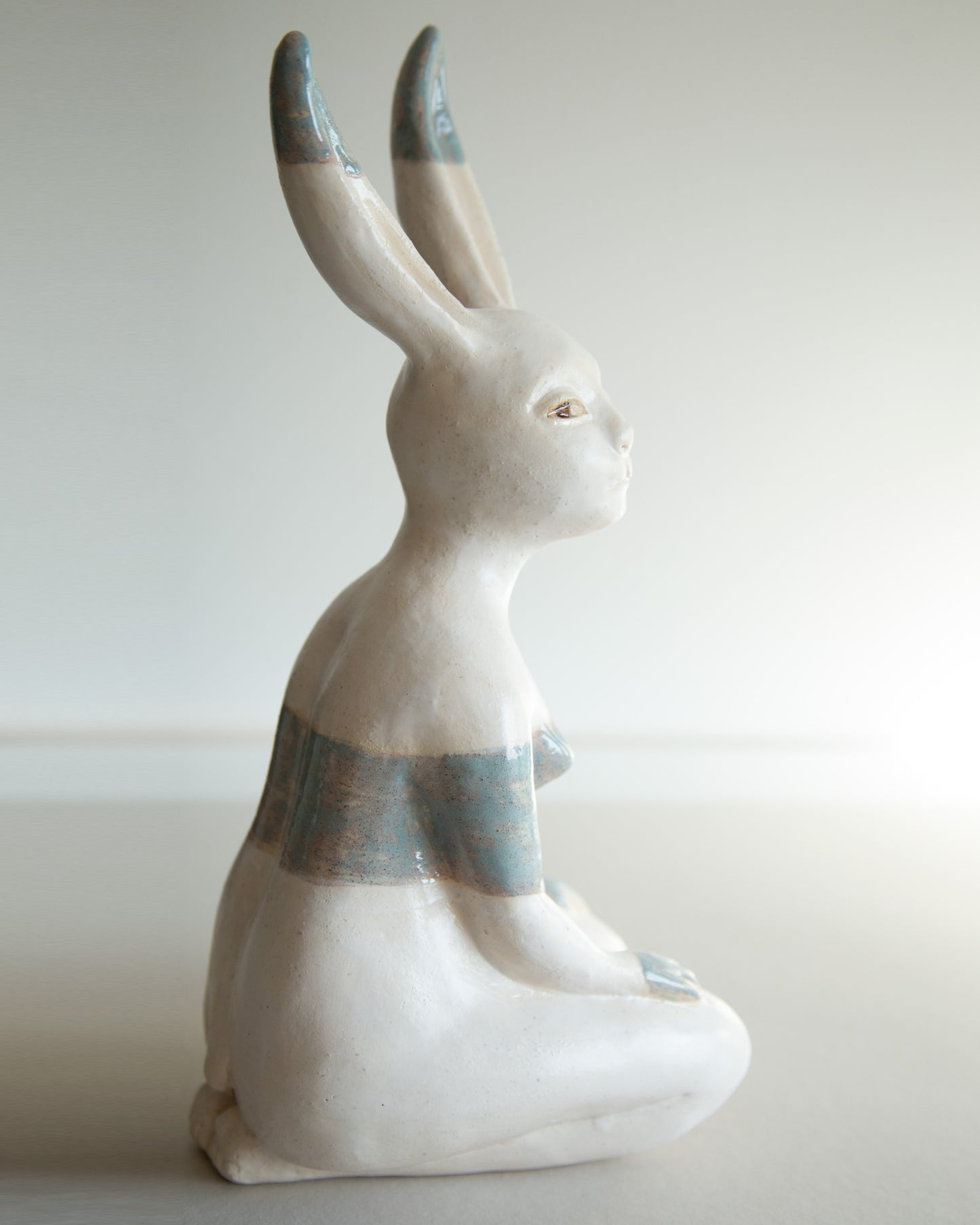Ceramic statue of hare bodypositive girl, whimsical guitar body rabbit character, weird bunny sculpture decor