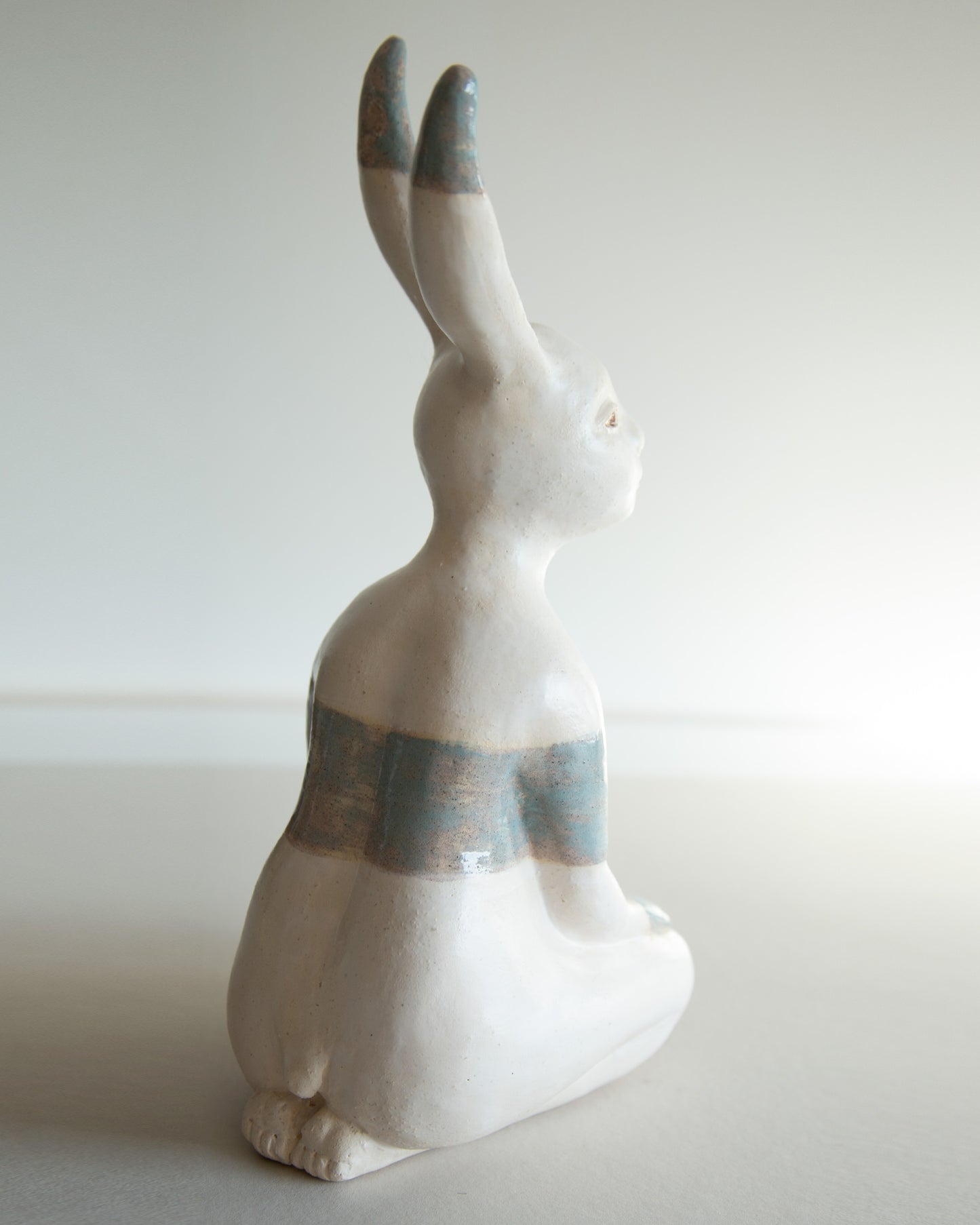Ceramic statue of hare bodypositive girl, whimsical guitar body rabbit character, weird bunny sculpture decor