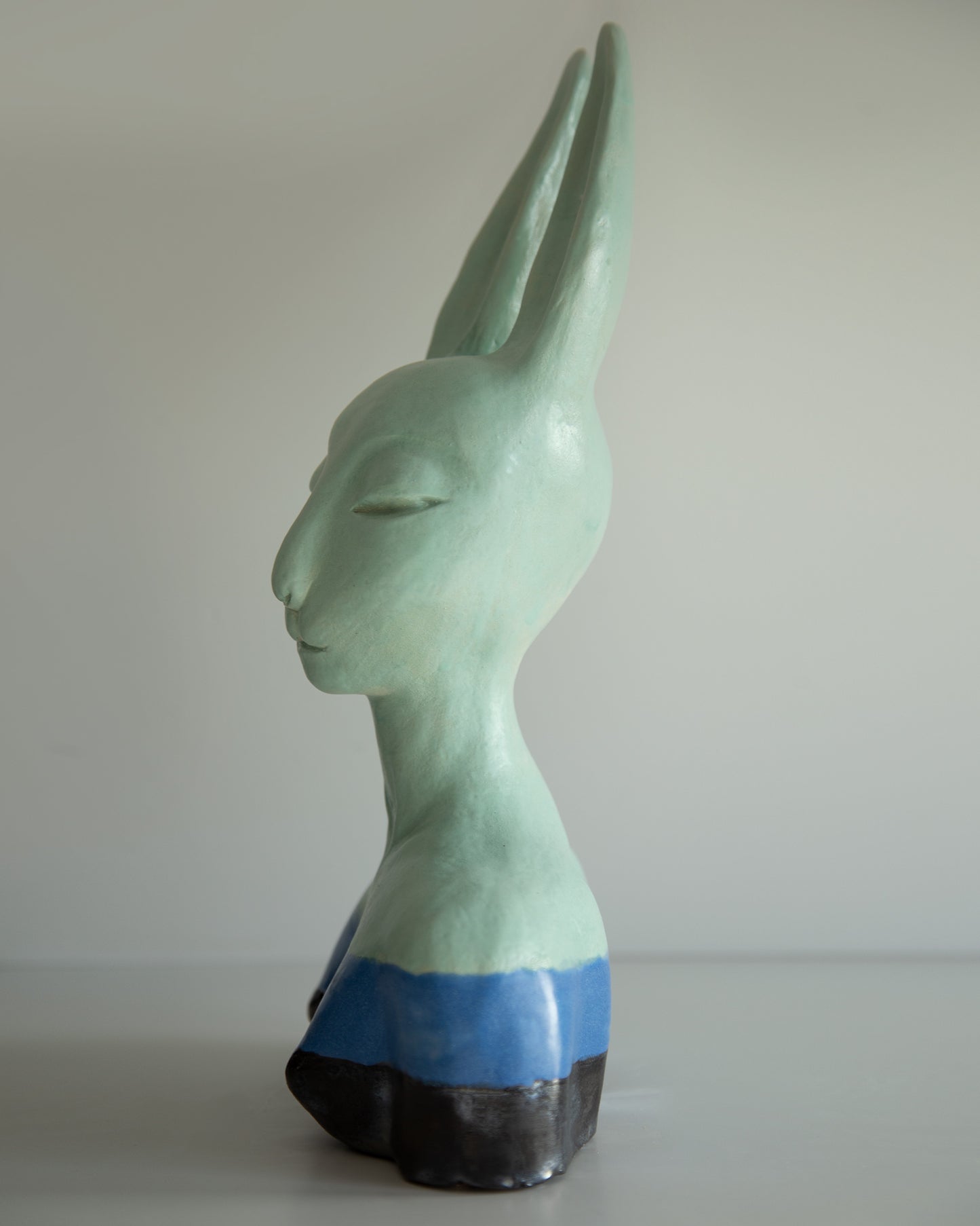 Hare woman bust statue with proud face, whimsical ceramic sculptural original art decor, mint-blue-black color