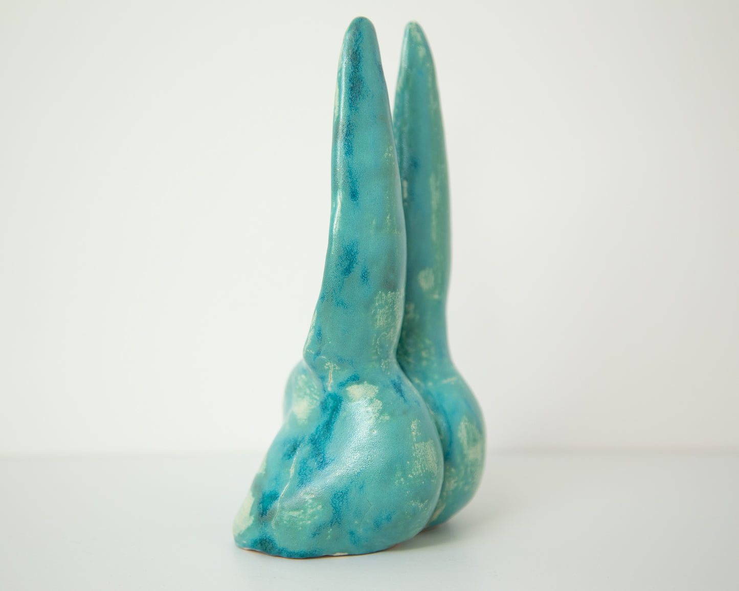 Glazed Ceramic Nude Sculpture: Playful Bunny-Eared Booty Art