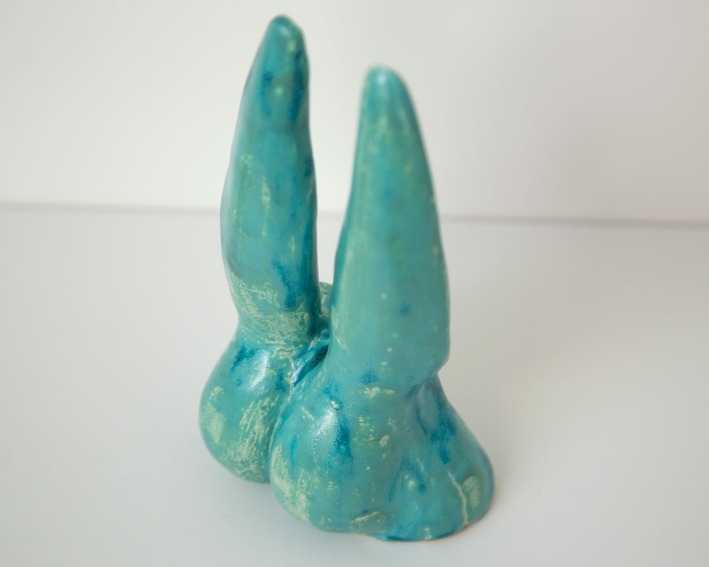 Glazed Ceramic Nude Sculpture: Playful Bunny-Eared Booty Art