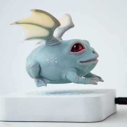 Levitating frog kinetic sculpture with dragon wings, weird and magic frog doll figurine with levitation pod