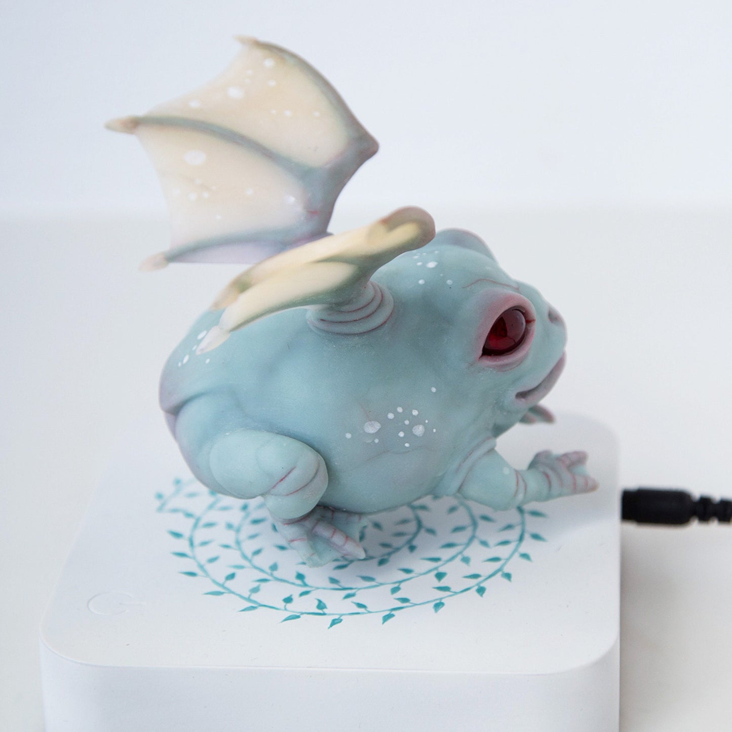 Levitating frog kinetic sculpture with dragon wings, weird and magic frog doll figurine with levitation pod