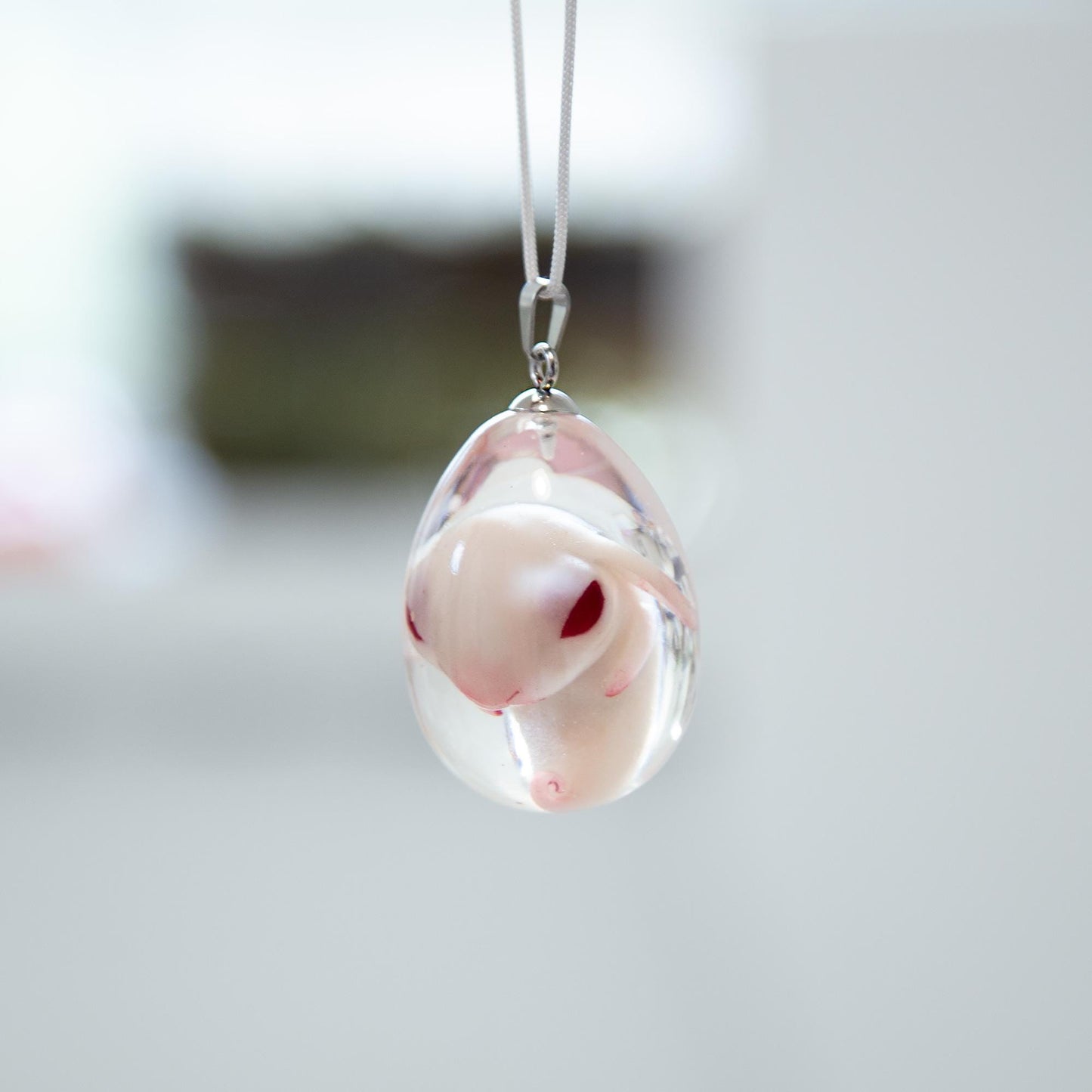 Baby Rabbit in egg pendant. Embryo horror jewelry, necklace with cute rabbit inside