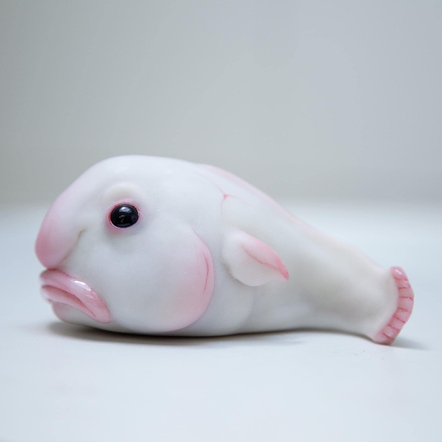 Cute sad and funny blobfish anime figurine, weird geek pop art sculpture