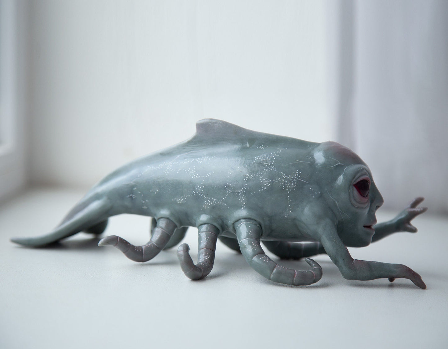 Alien cryptid kraken-whale deep sea creature, creepy sculpture, alien figurine with tentacle