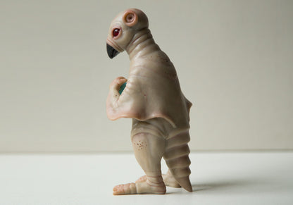 Strange, weird and unusual creepy alien doll sculpture, fantastic pinguin like beast, creepy surreal dark art