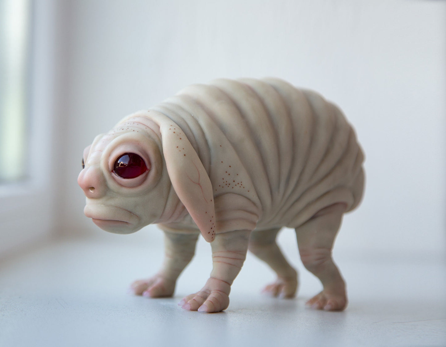 Squonk of Pennsylvania, creepy cute weird and sad PA cryptid creature, weird sculpture cryptid miniature