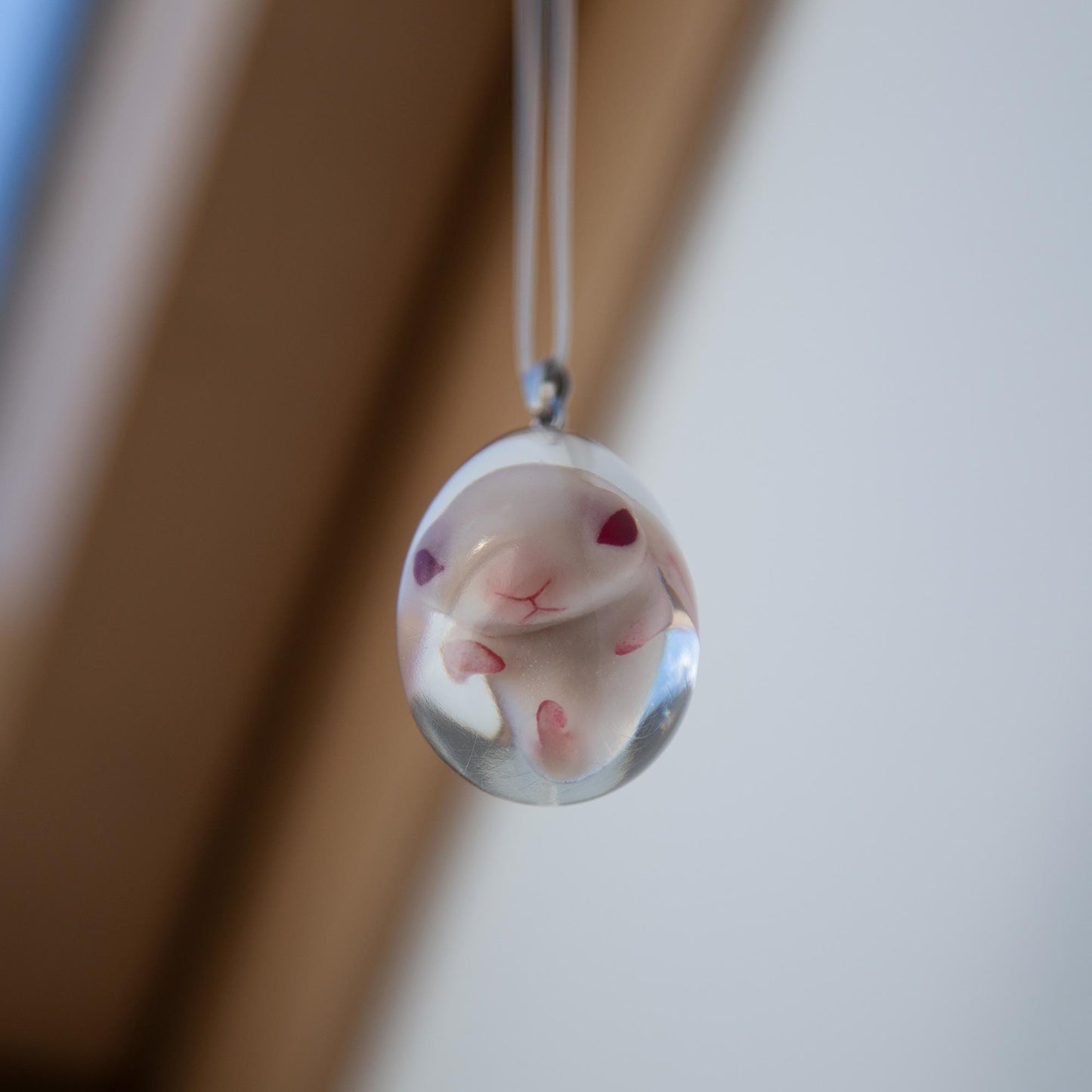 Baby Rabbit in egg pendant. Embryo horror jewelry, necklace with cute rabbit inside