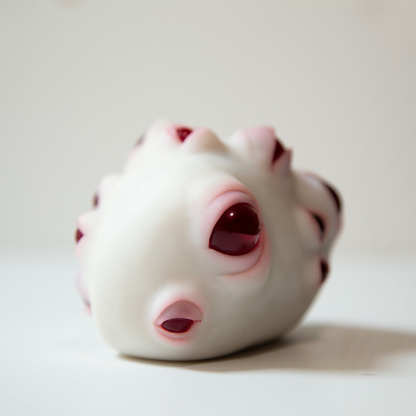 Weird alien lifeform, art doll creature with red eyes, round evil eye protection for your home!