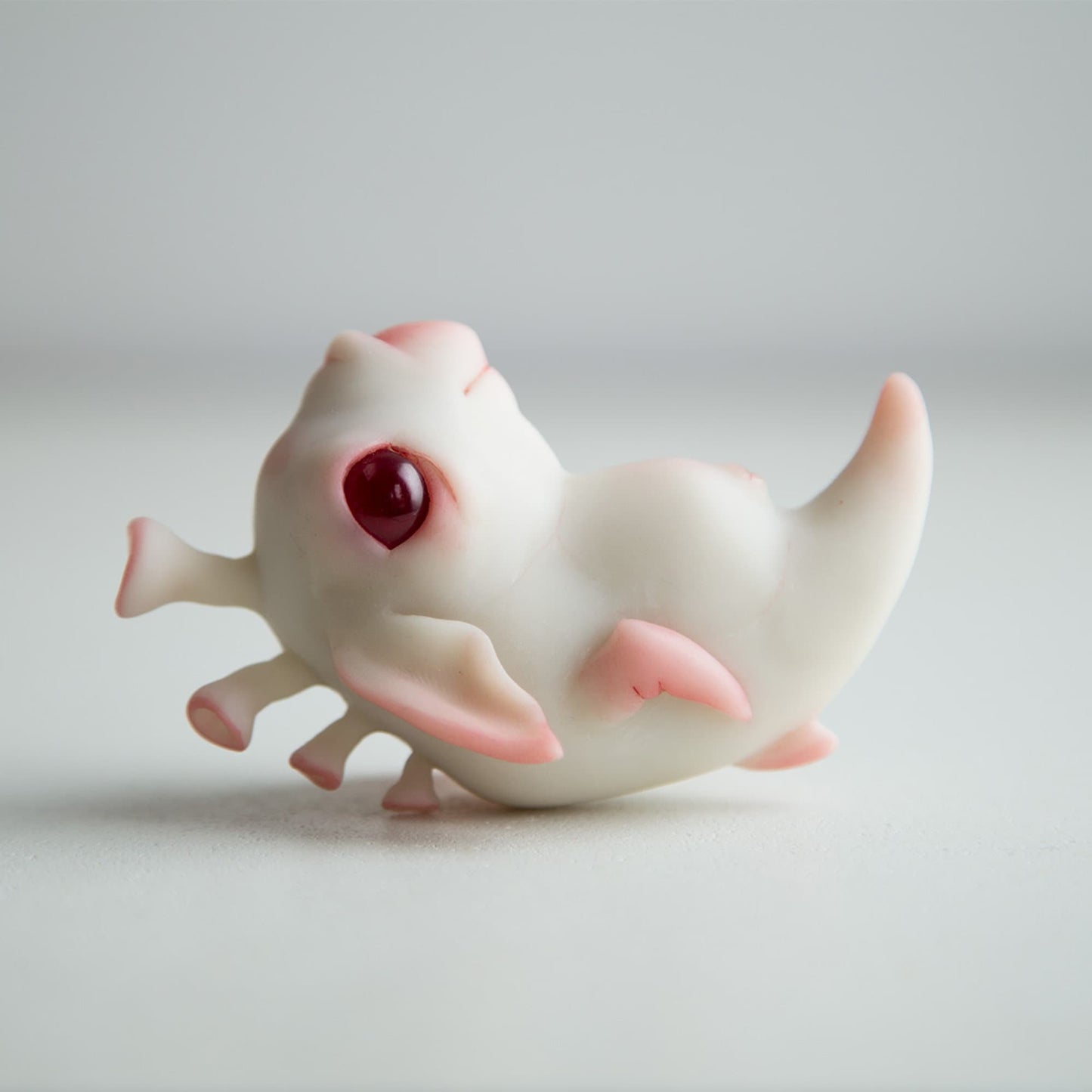 Baby alien weird sea horse sculpture art doll,  cute figurine with albino eyes in anime style