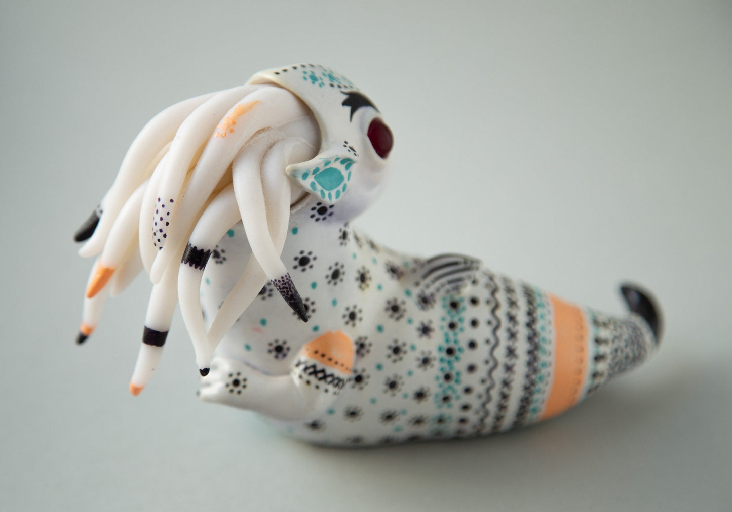 Dragon art doll with handpainted folk art ornament in swedish - norwegian - finnish style