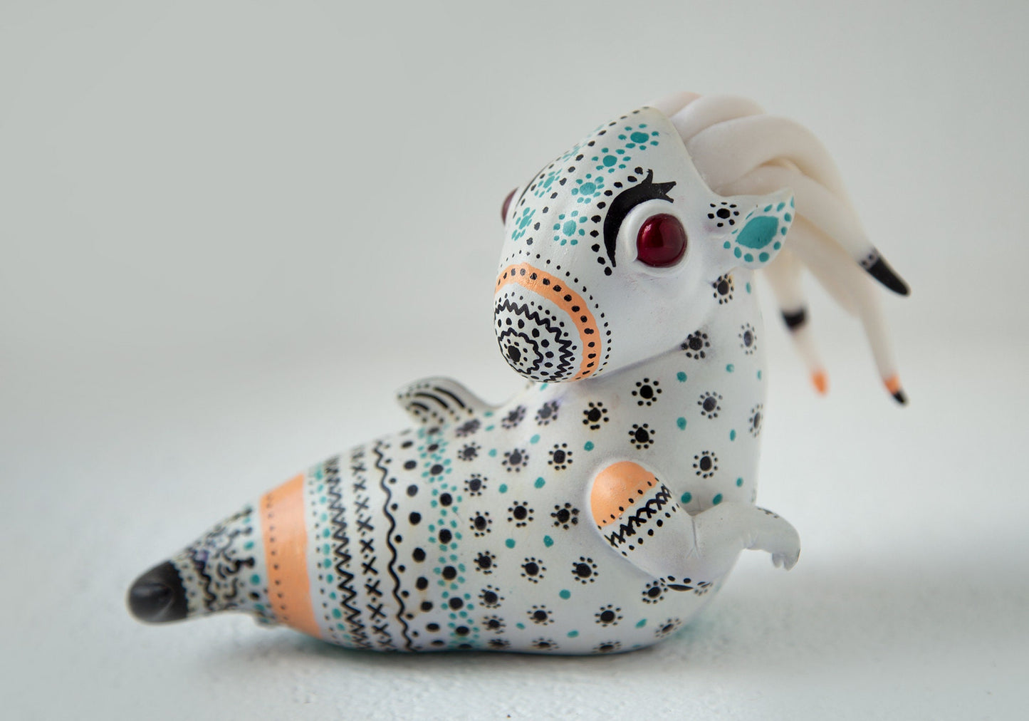 OOAK made and handpainted sculpture made from polymer clay with scandinavian (swedish/norvegian/finnish) stylized ornament elements.