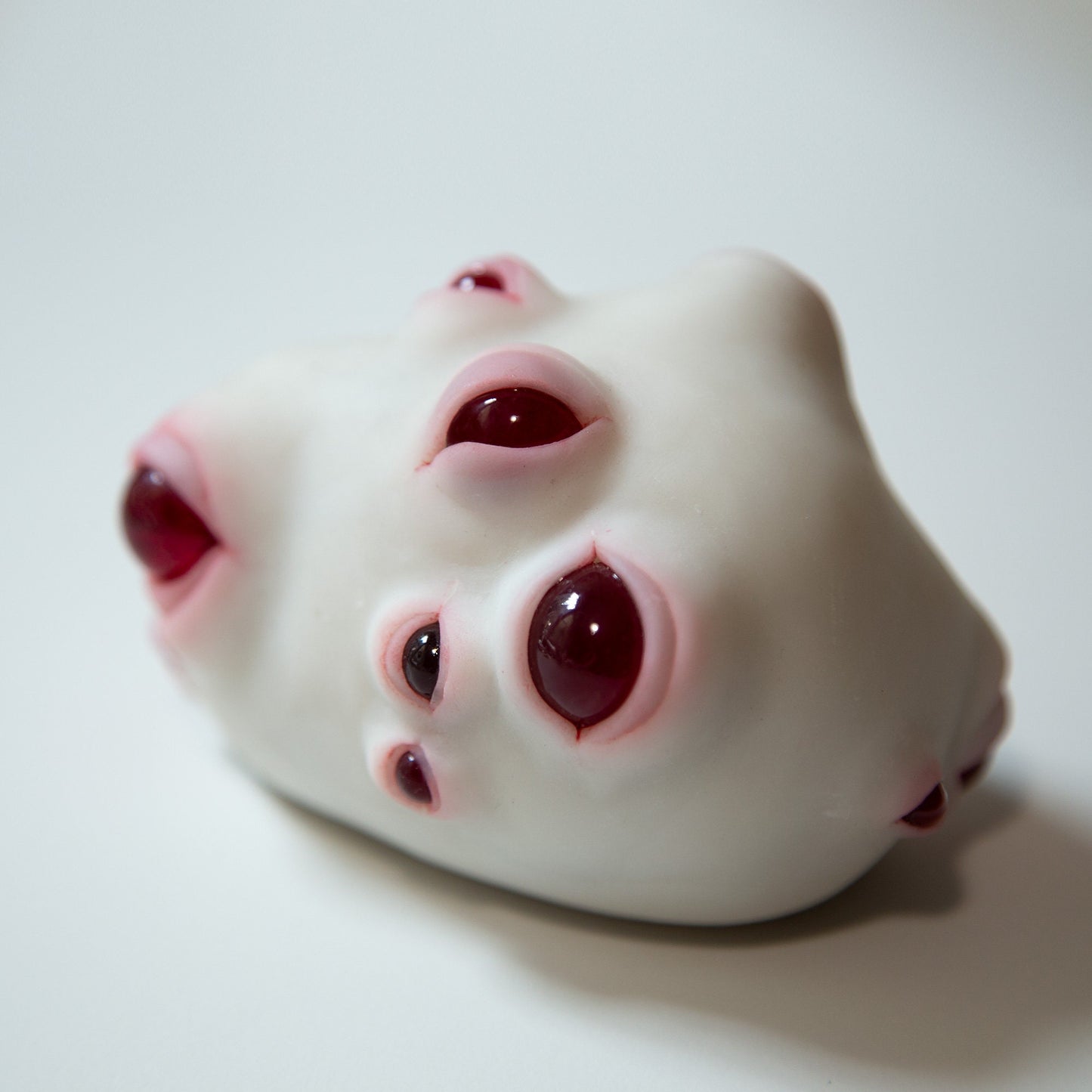 Weird alien lifeform, art doll creature with red eyes, round evil eye protection for your home!