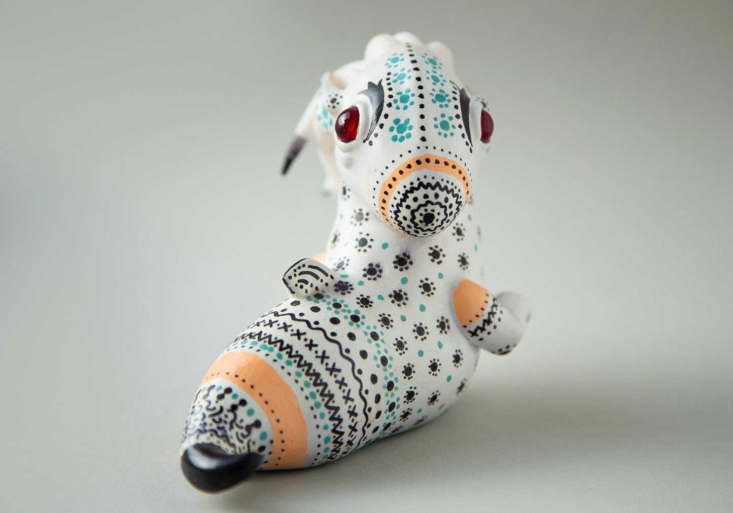 Dragon art doll with handpainted folk art ornament in swedish - norwegian - finnish style