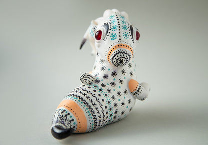 Dragon art doll with handpainted folk art ornament in swedish - norwegian - finnish style