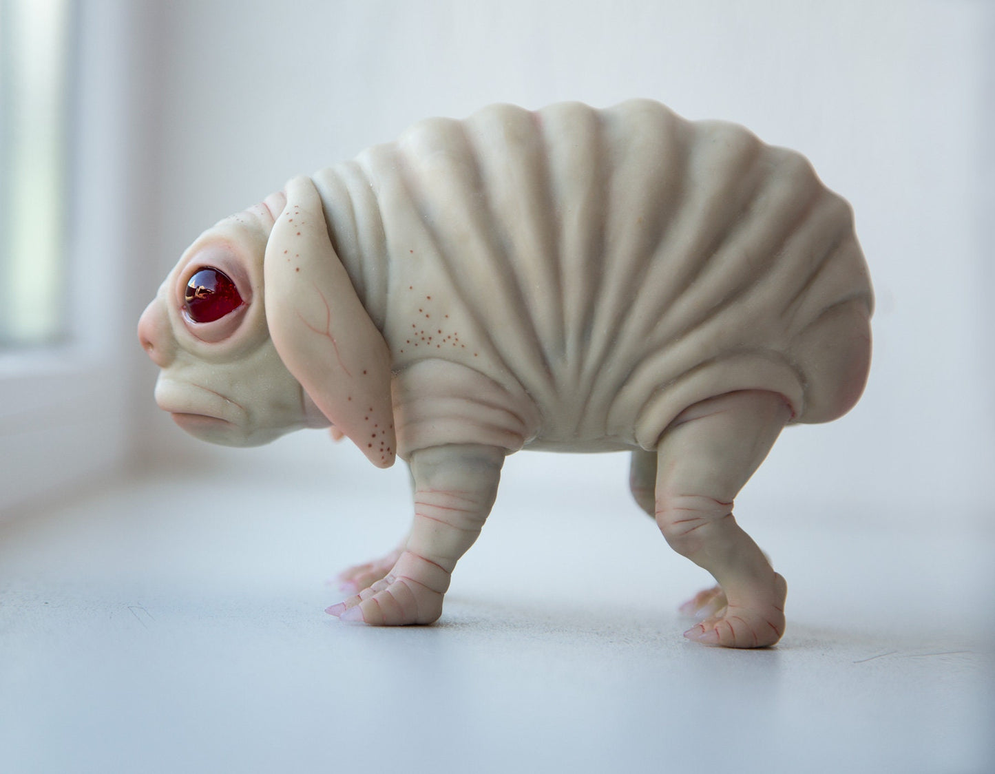 Squonk of Pennsylvania, creepy cute weird and sad PA cryptid creature, weird sculpture cryptid miniature